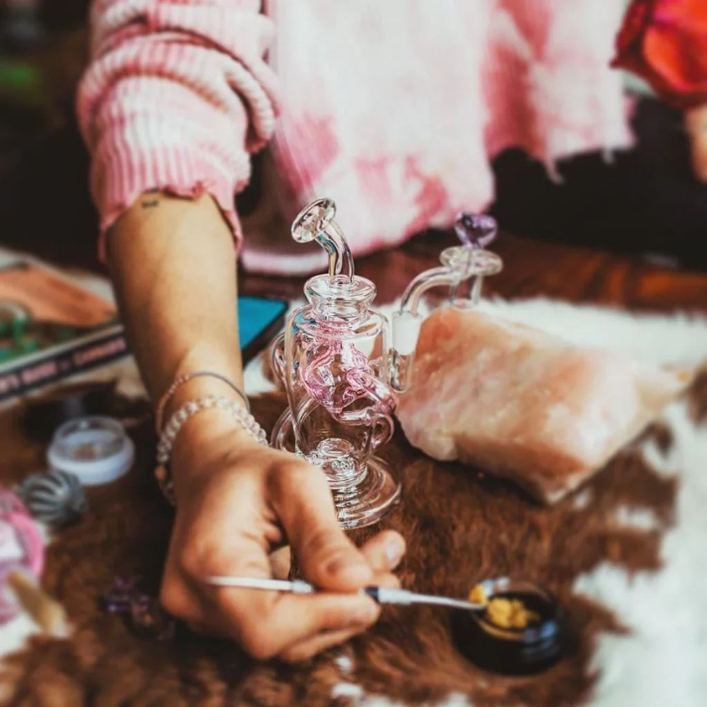 picture of a person scooping shatter or crumble into their mj arsenal dab rig