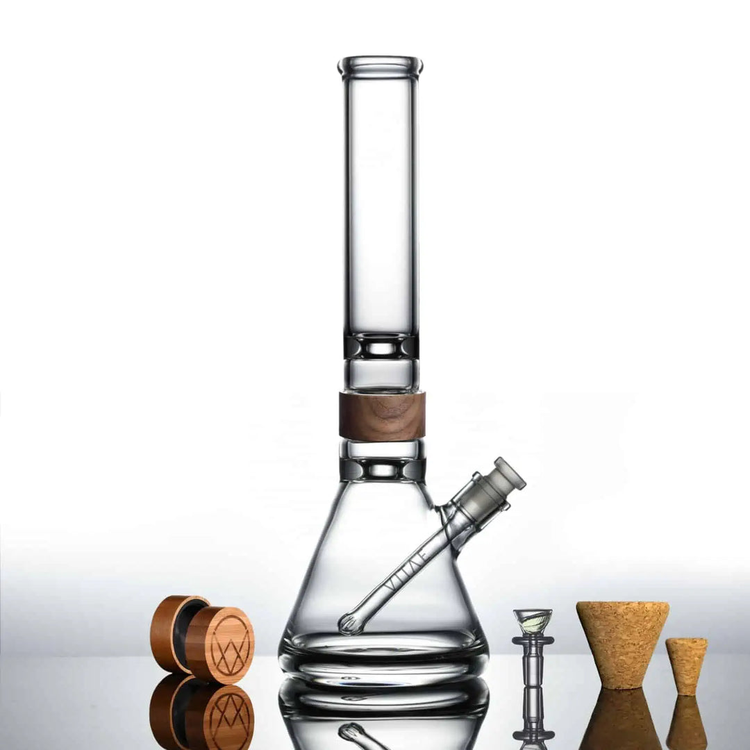 Elegant 16-inch Alpha Bong by Vitae Glass, featuring robust glass construction and a modern design, against a minimalist background